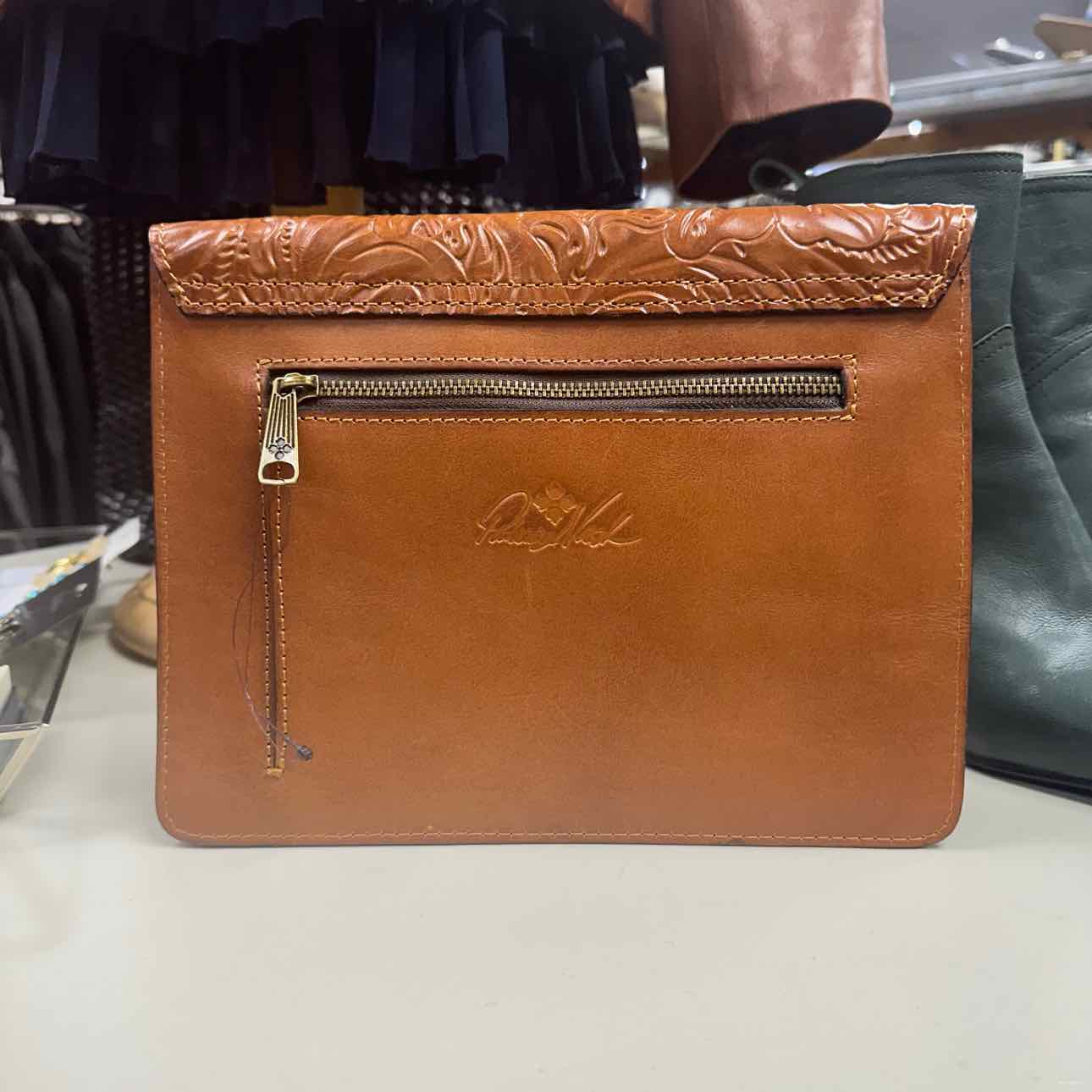 brown leather clutch